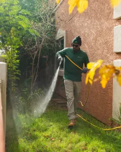 greenleaf exterminator spraying the home