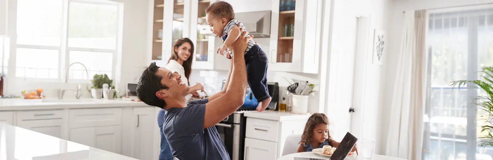 family eating breakfast in kitchen